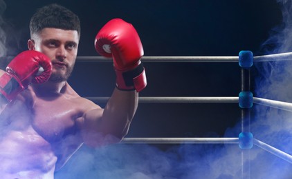 Image of Boxer training on boxing ring in color smoke. Space for text