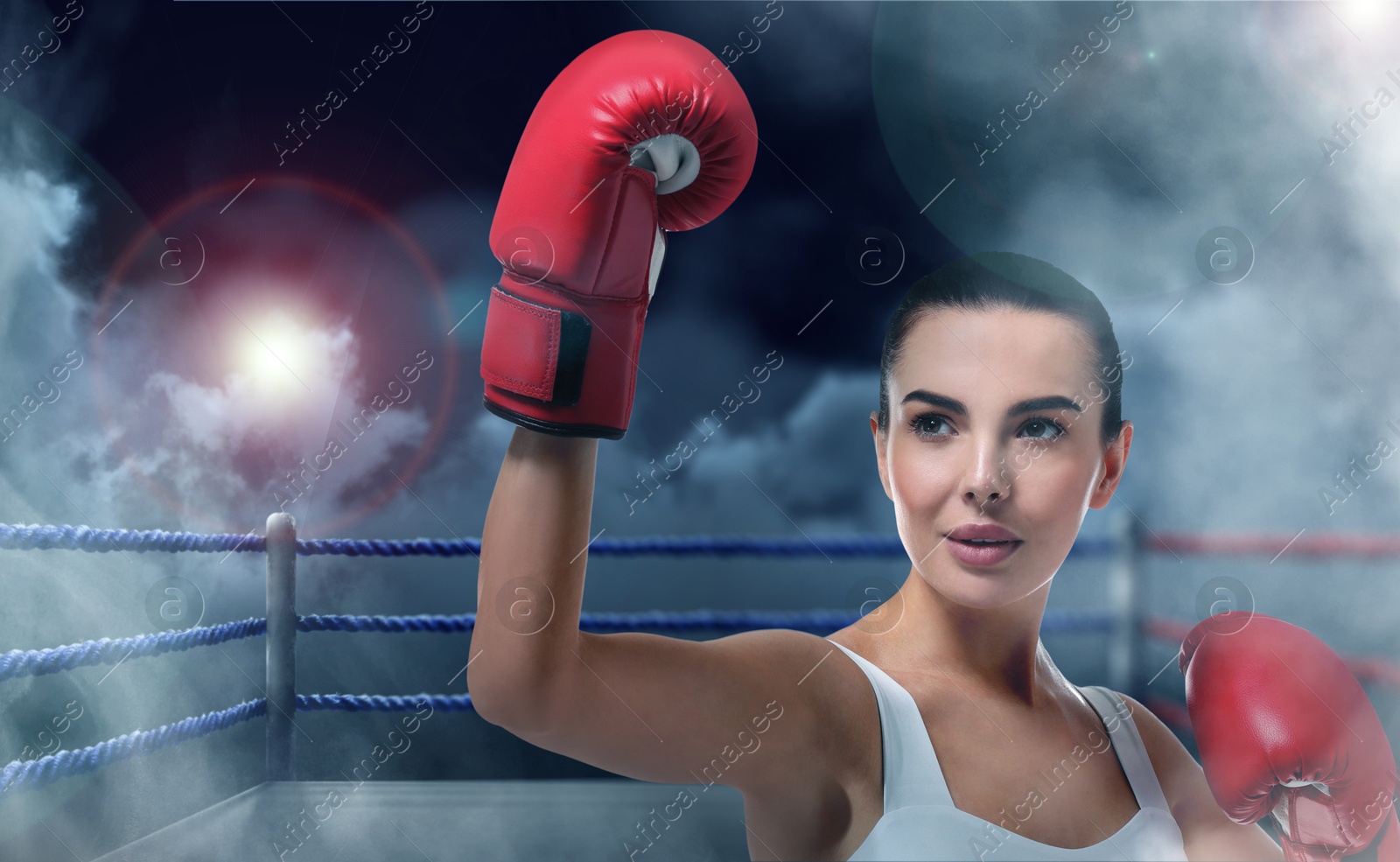 Image of Boxer training on boxing ring in smoke