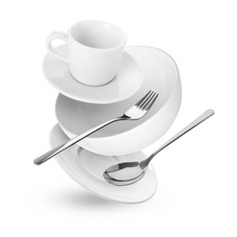 Clean dishware and silverware flying on white background