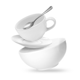 Image of Clean dishware and teaspoon flying on white background