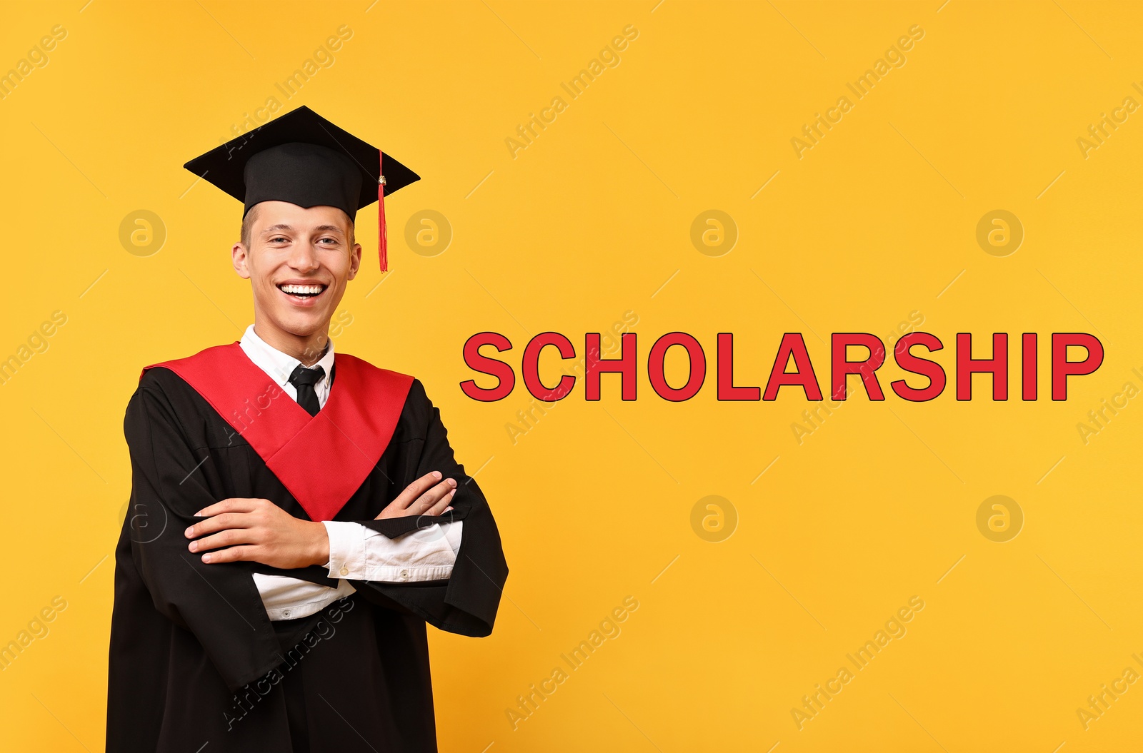 Image of Scholarship. Happy student in academic dress on orange background