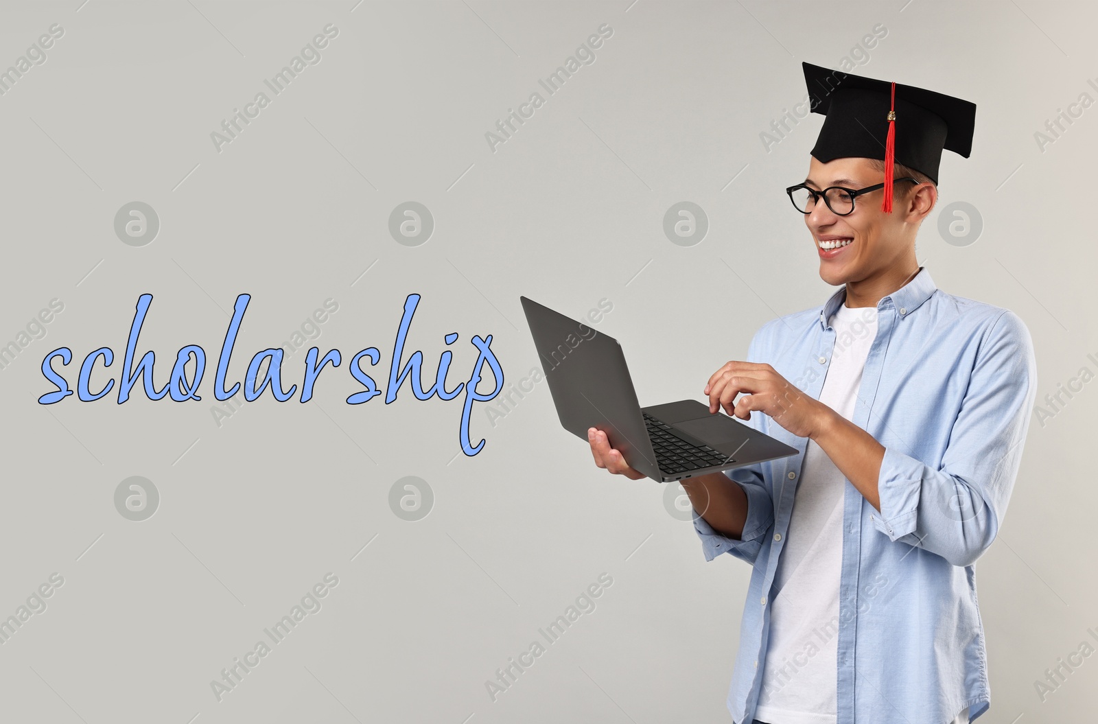 Image of Scholarship. Happy student with laptop and graduate cap on grey background