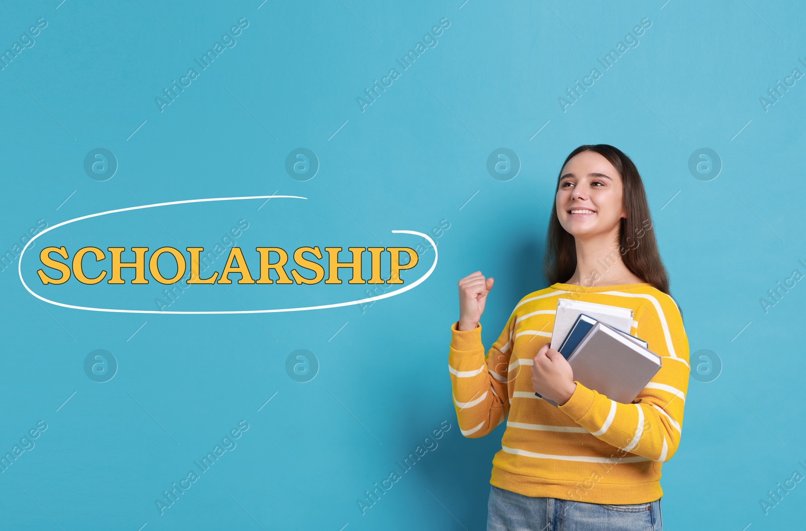 Image of Scholarship. Happy young student with books on light blue background