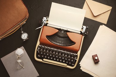 Image of Old vintage typewriter with paper on writer's table, top view