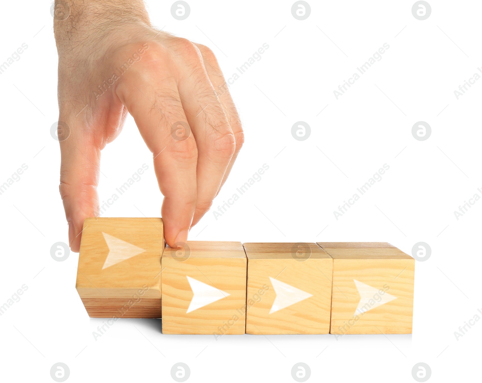 Image of Woman holding cube with arrow on white background, closeup