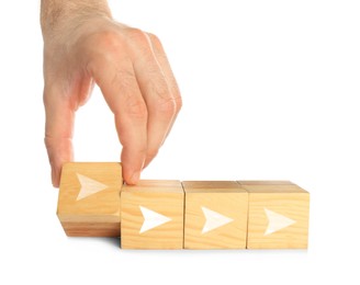 Image of Woman holding cube with arrow on white background, closeup