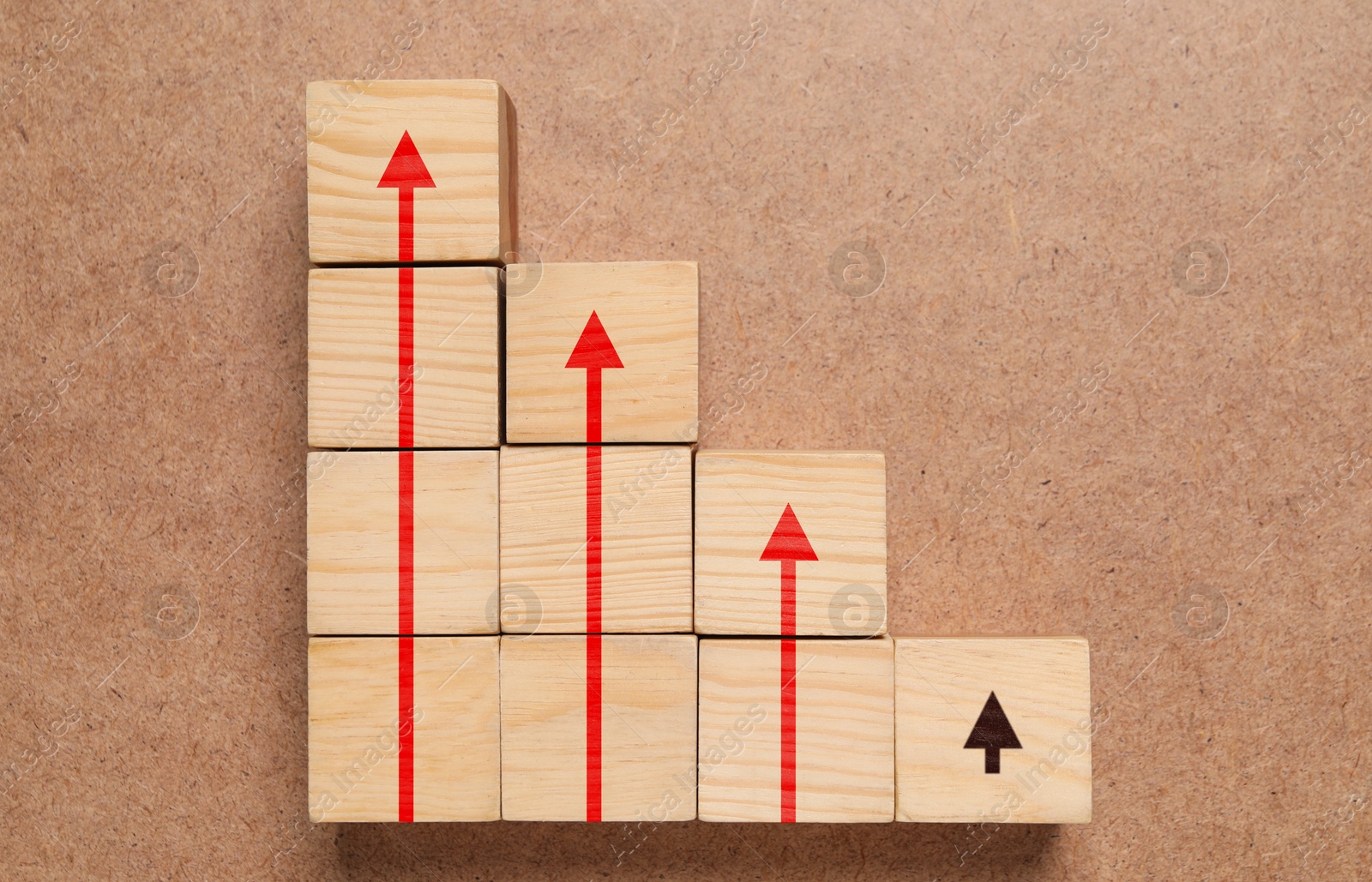 Image of Cubes with arrows on wooden background, top view