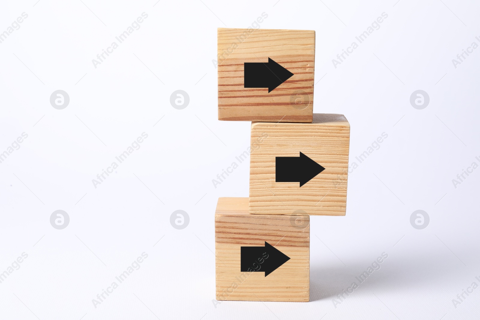 Image of Wooden cubes with black arrows on white background