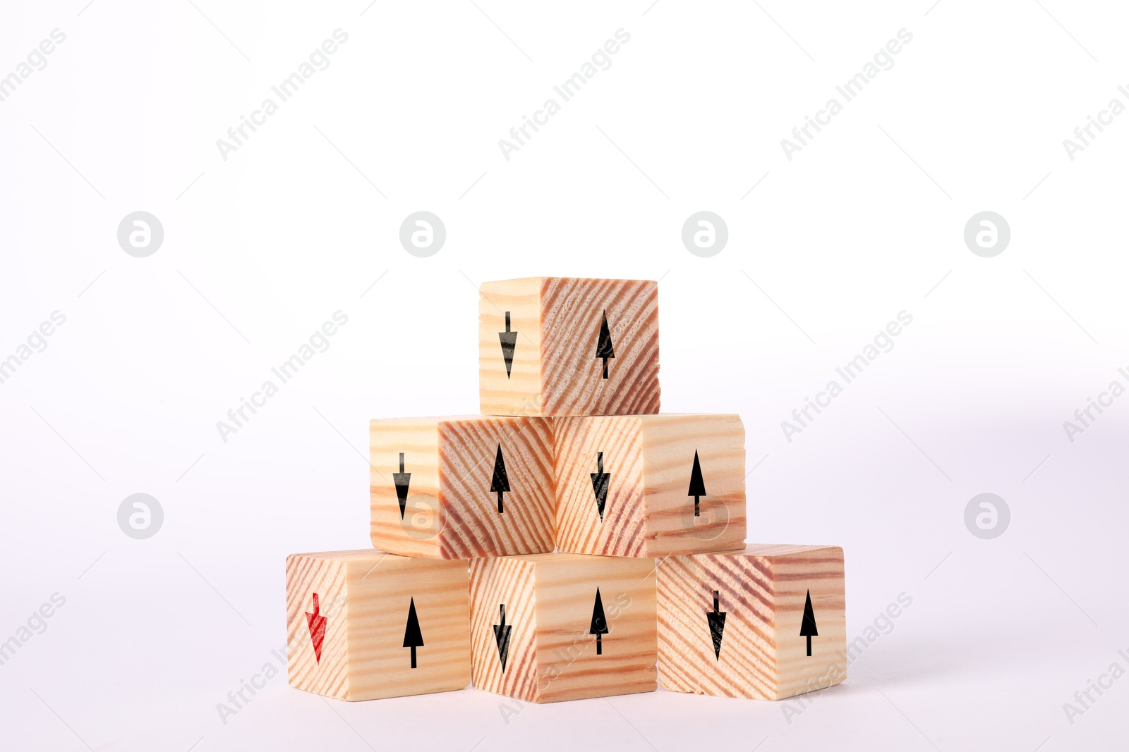 Image of Wooden cubes with black and one red arrows on white background