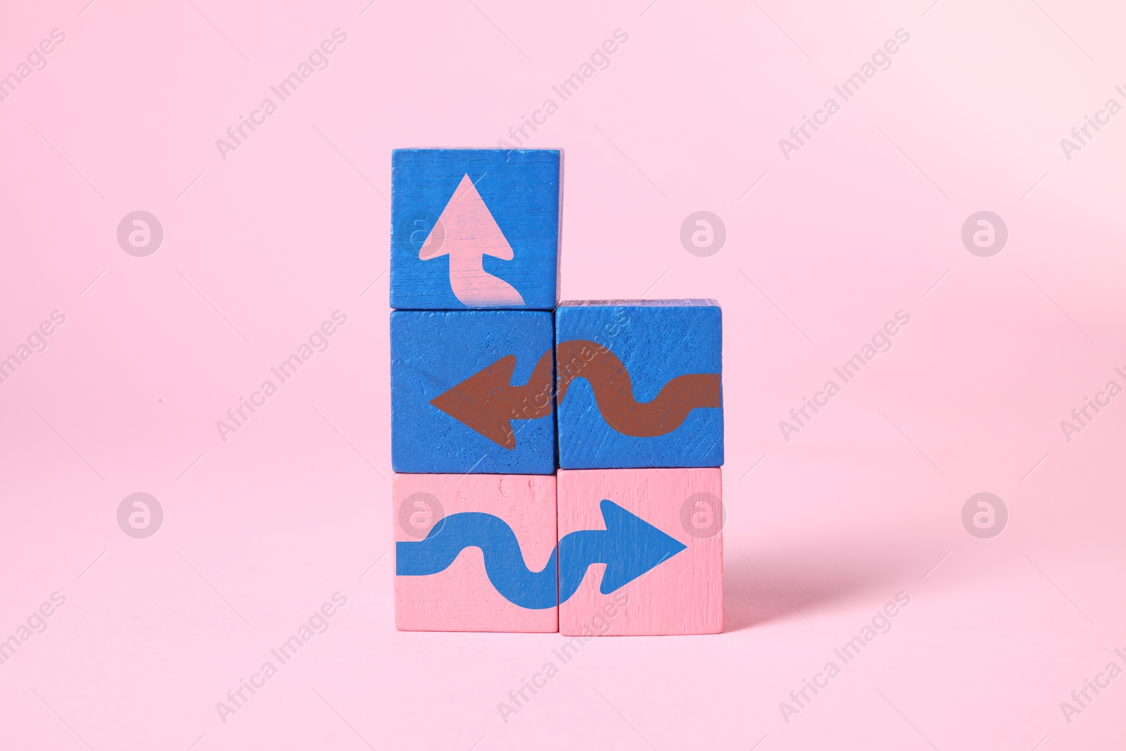 Image of Colorful cubes with arrows on pink background