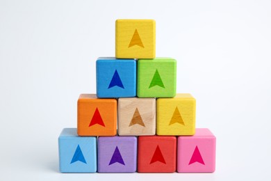 Image of Colorful cubes with arrows on white background