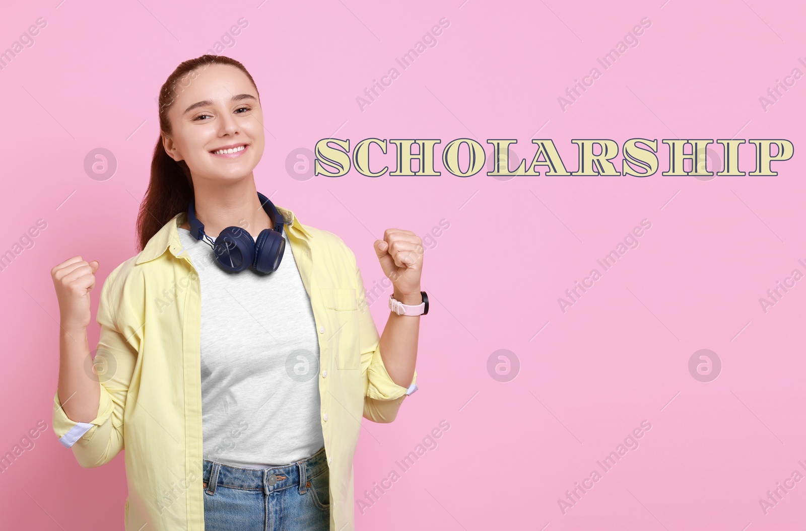 Image of Scholarship. Happy young student with headphones on pink background