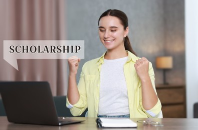 Image of Scholarship. Happy young student with laptop at table