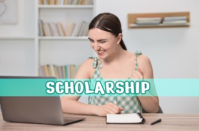 Image of Scholarship. Happy student with laptop at table indoors