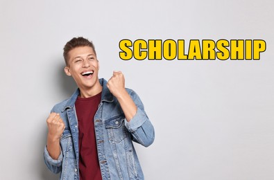 Image of Scholarship. Happy young student on light background