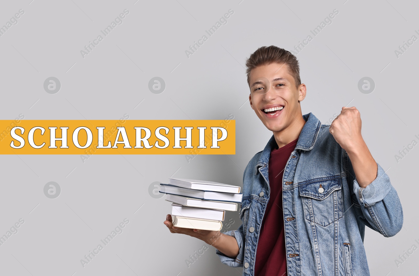 Image of Scholarship. Happy young student with books on light background