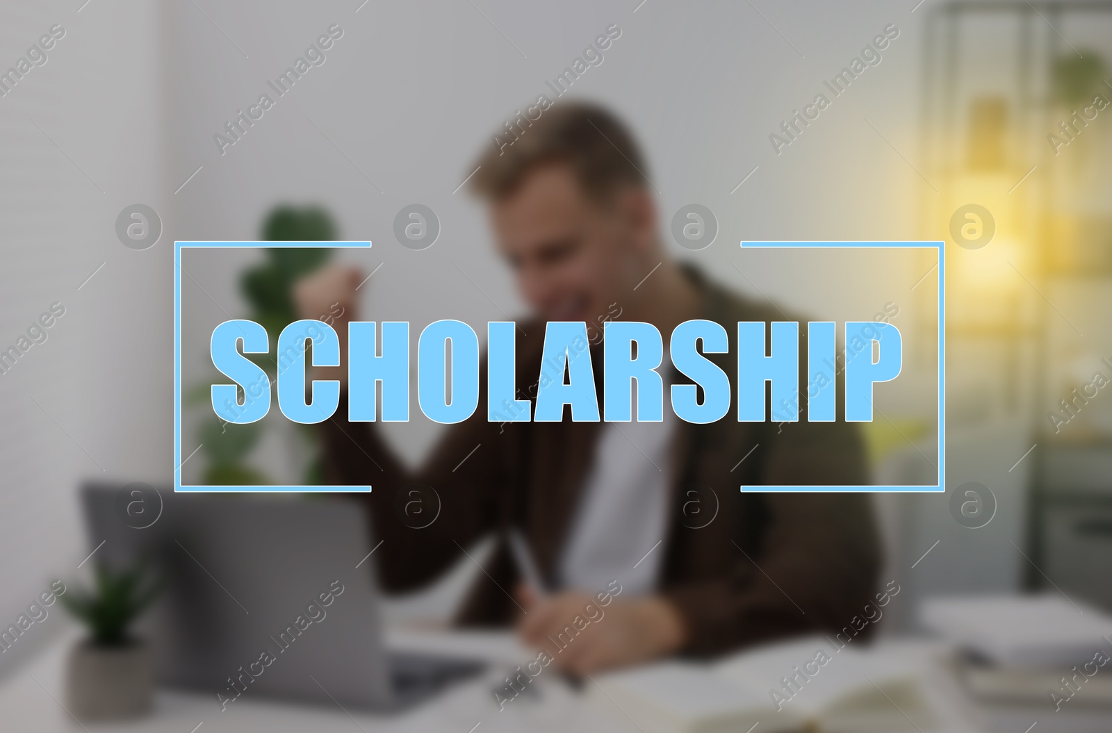 Image of Scholarship. Happy student with laptop at table, blurred view