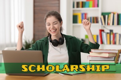 Image of Scholarship. Happy student with laptop at table