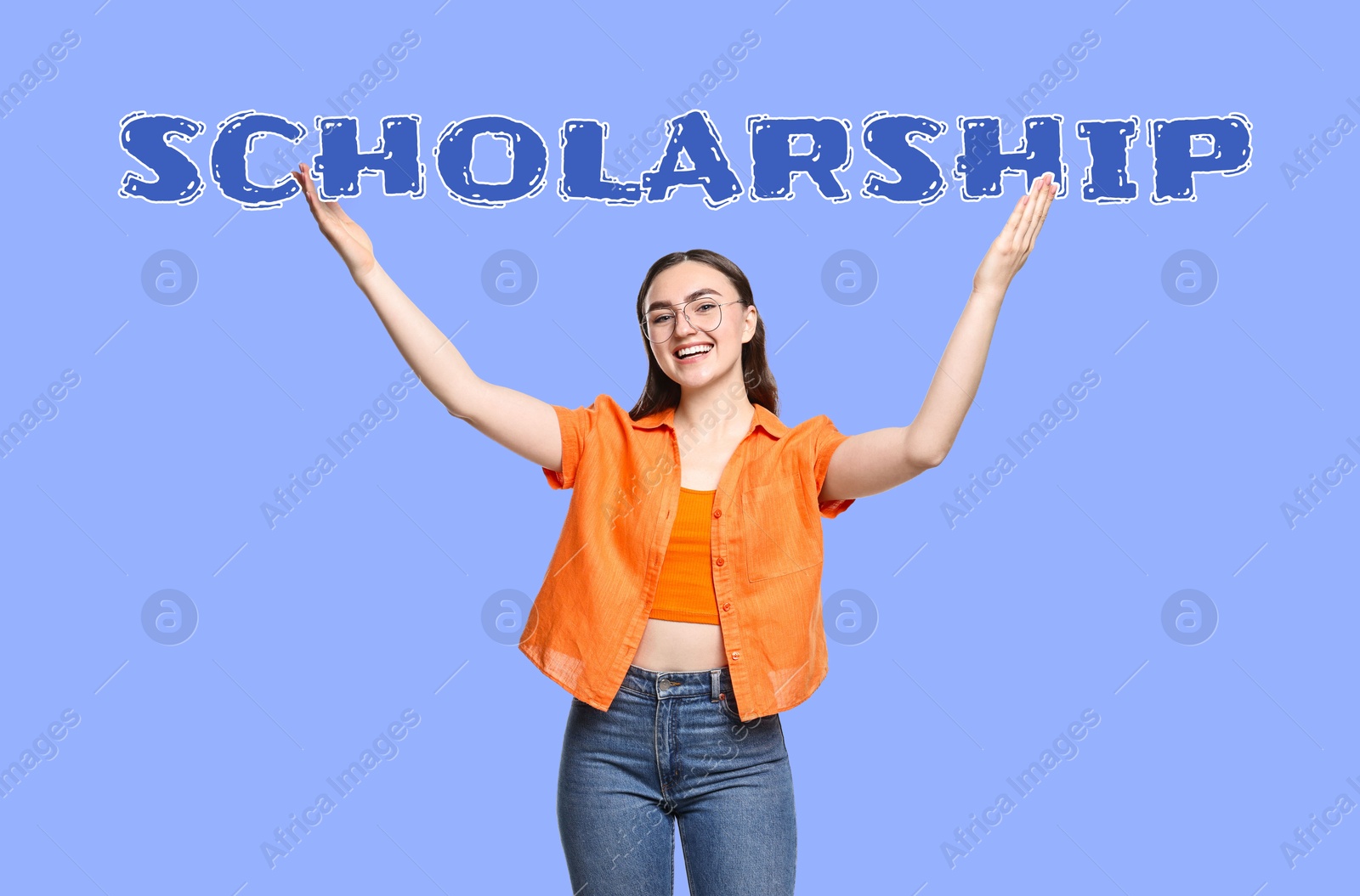 Image of Scholarship. Happy student holding word on violet blue background