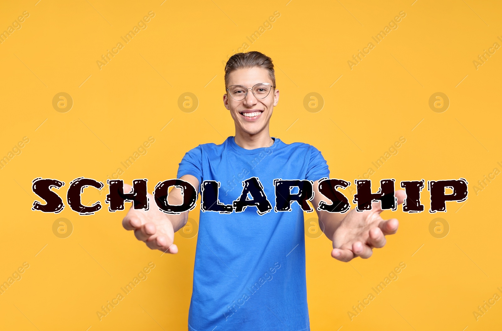 Image of Scholarship. Happy student holding word on orange background