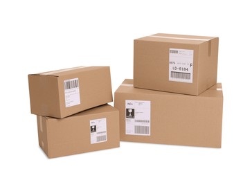 Photo of Many parcels with shipment labels isolated on white