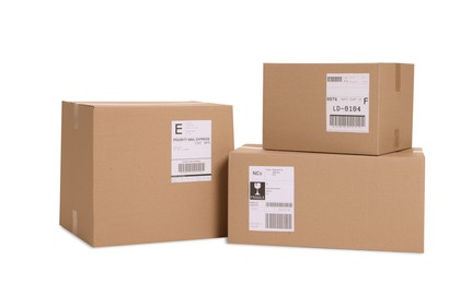 Photo of Many parcels with shipment labels isolated on white