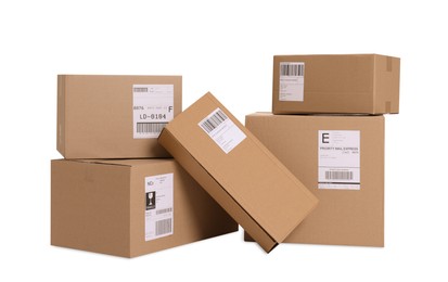 Photo of Many parcels with shipment labels isolated on white