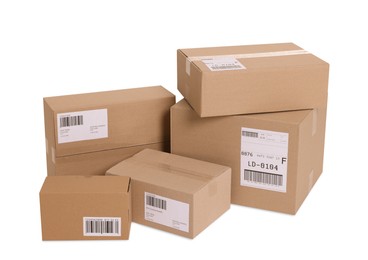 Photo of Many parcels with shipment labels isolated on white