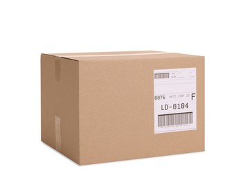 Photo of One parcel with shipment label isolated on white