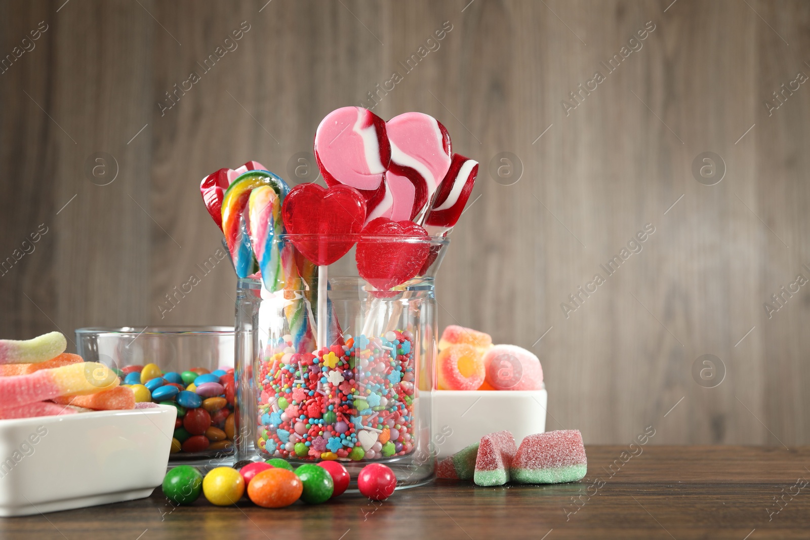 Photo of Candy bar. Many different tasty sweets on wooden table