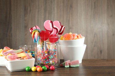 Candy bar. Many different tasty sweets on wooden table