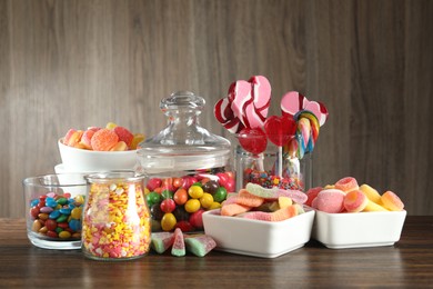 Photo of Candy bar. Many different tasty sweets on wooden table