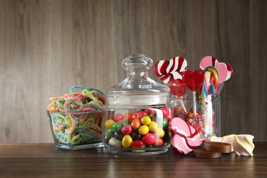 Candy bar. Many different tasty sweets on wooden table