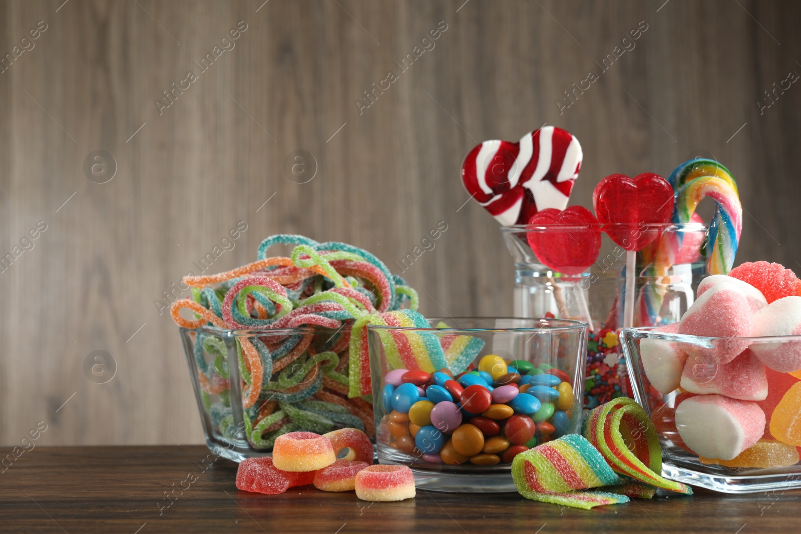 Photo of Candy bar. Many different tasty sweets on wooden table