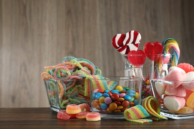 Candy bar. Many different tasty sweets on wooden table