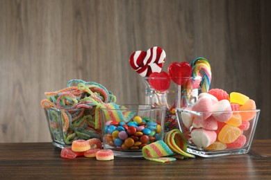 Candy bar. Many different tasty sweets on wooden table