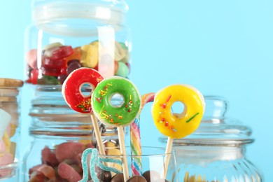 Photo of Candy bar. Many different sweets on light blue background, closeup