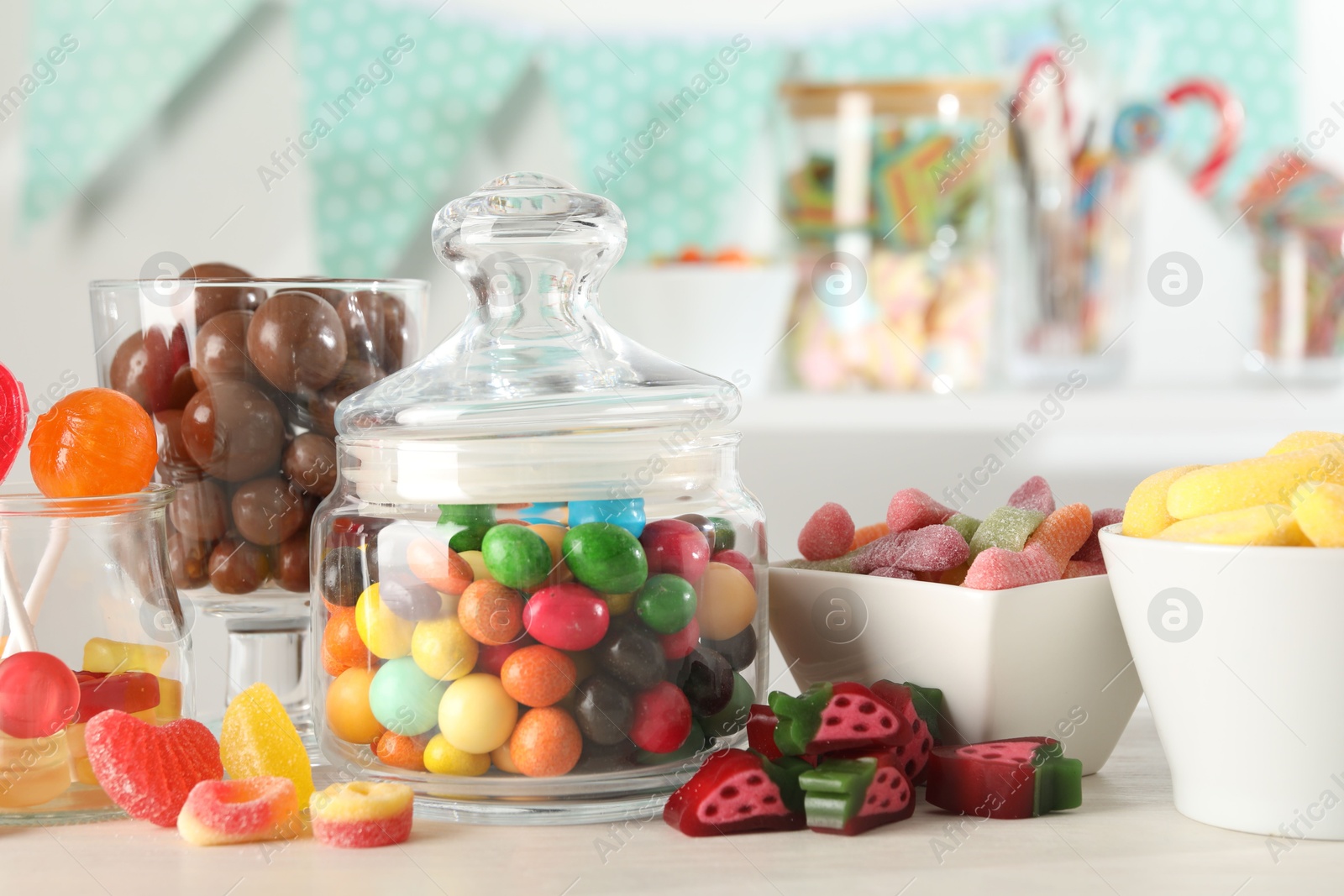 Photo of Candy bar. Many different sweets on white table indoors, closeup