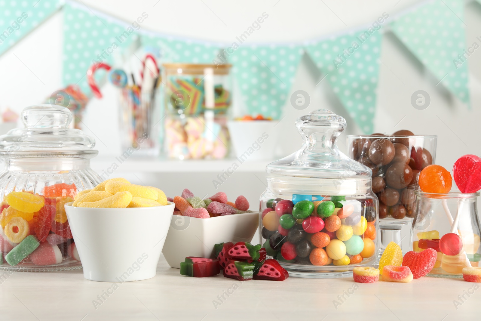 Photo of Candy bar. Many different sweets on white table indoors