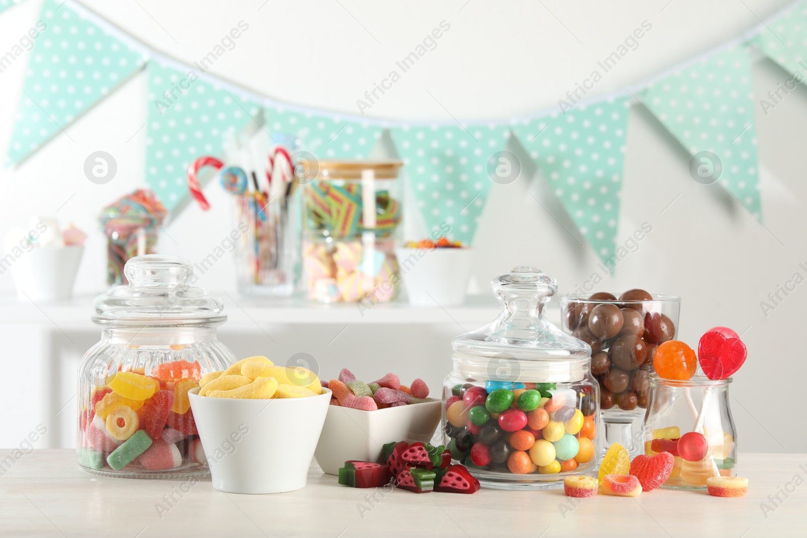 Photo of Candy bar. Many different sweets on white table indoors