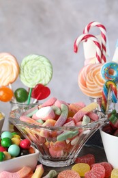 Photo of Candy bar. Many different sweets on table against grey background, closeup