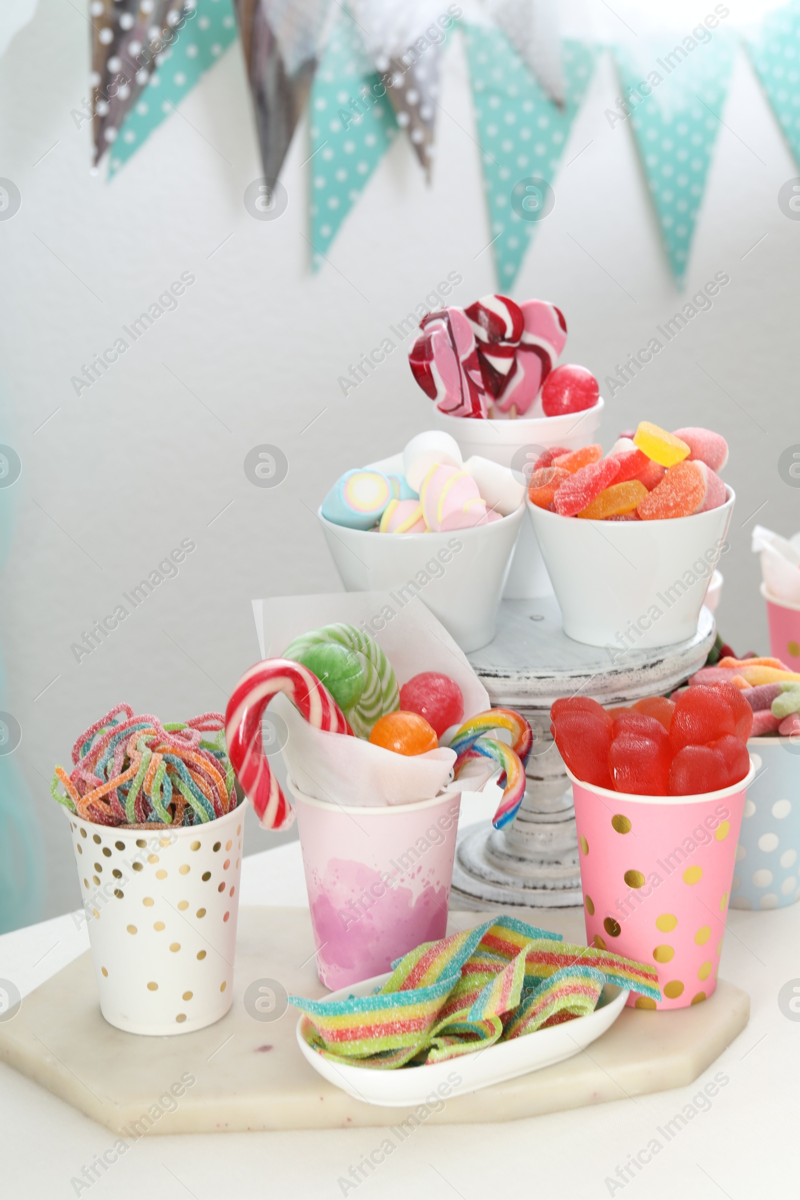 Photo of Candy bar. Different yummy sweets on white table indoors