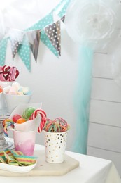 Photo of Candy bar. Different yummy sweets on white table indoors. Space for text