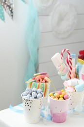 Photo of Candy bar. Different yummy sweets on white table indoors. Space for text