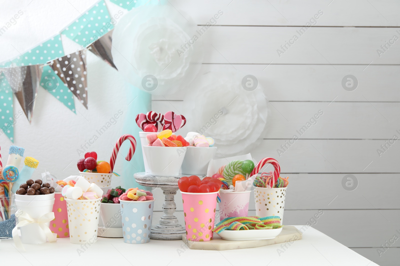 Photo of Candy bar. Different yummy sweets on white table indoors. Space for text