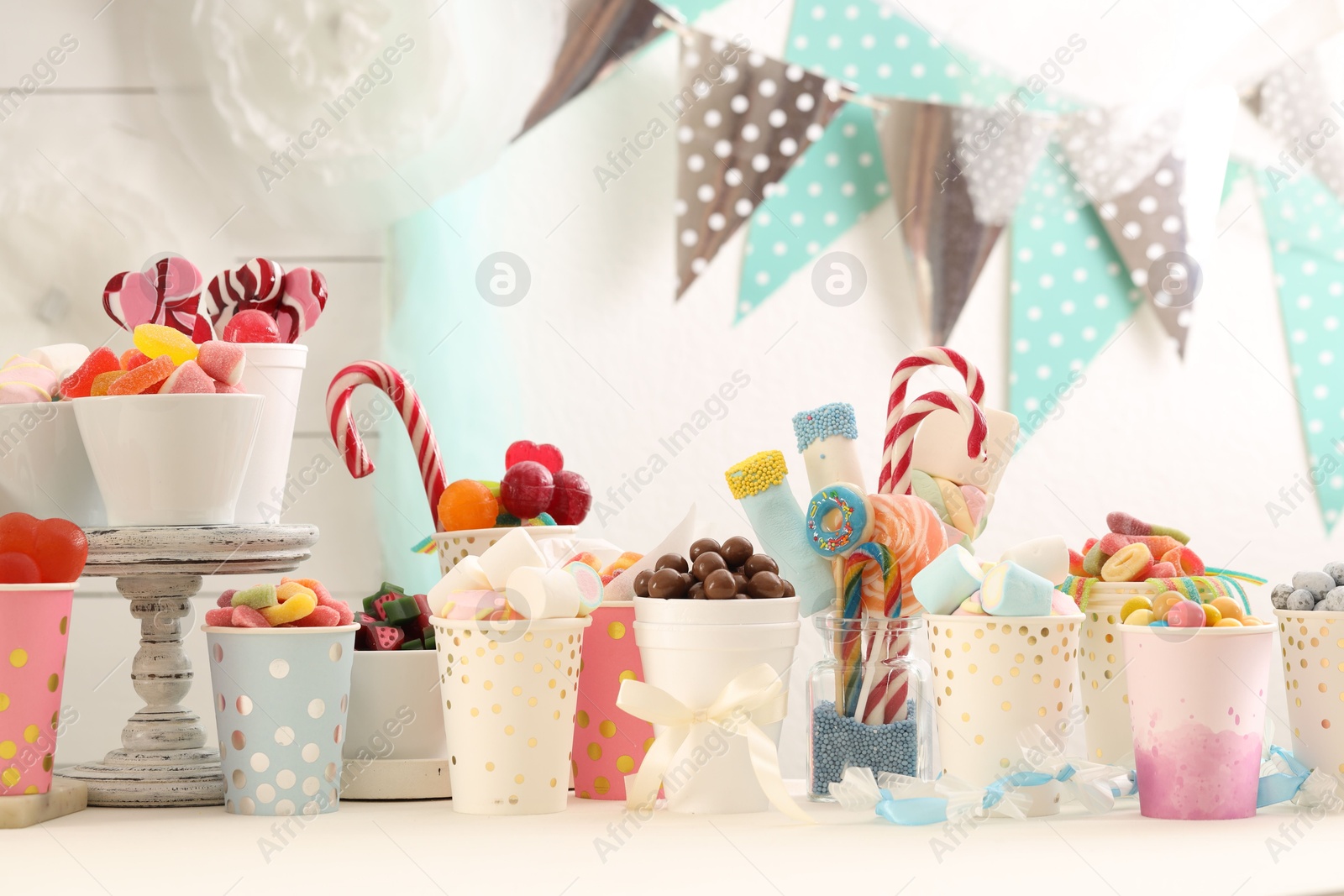 Photo of Candy bar. Different yummy sweets on white table indoors