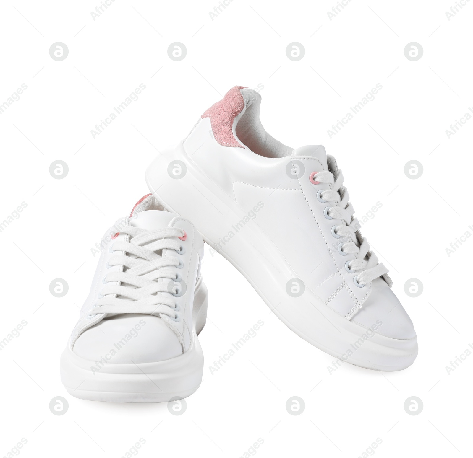 Photo of Pair of stylish sneakers isolated on white. Sportive shoes