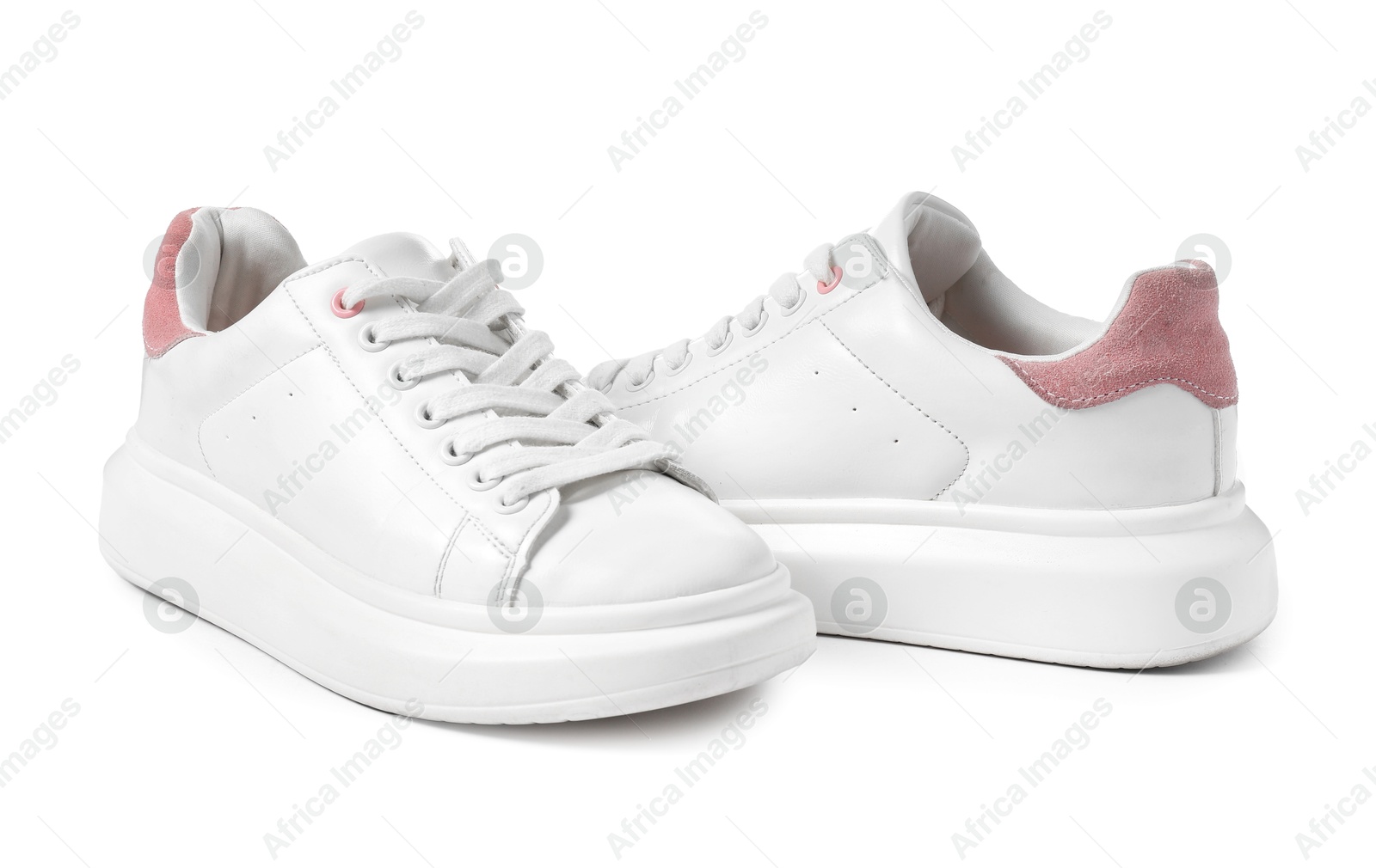 Photo of Pair of stylish sneakers isolated on white. Sportive shoes