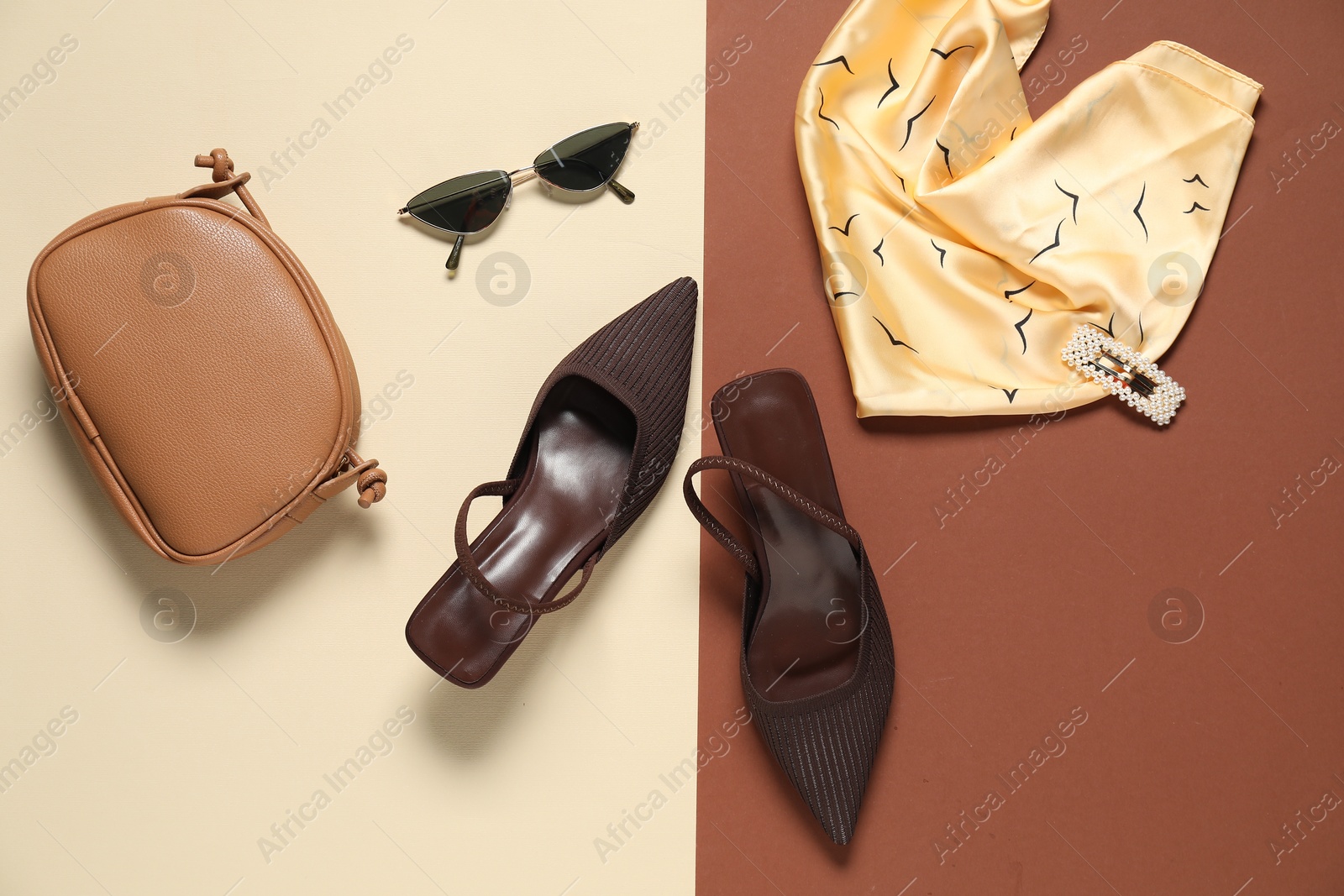 Photo of Stylish brown shoes, bag, scarf and sunglasses on color background, flat lay