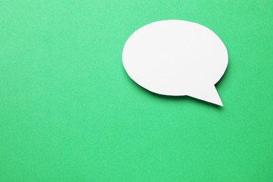 Photo of Blank speech bubble on green background. Space for text